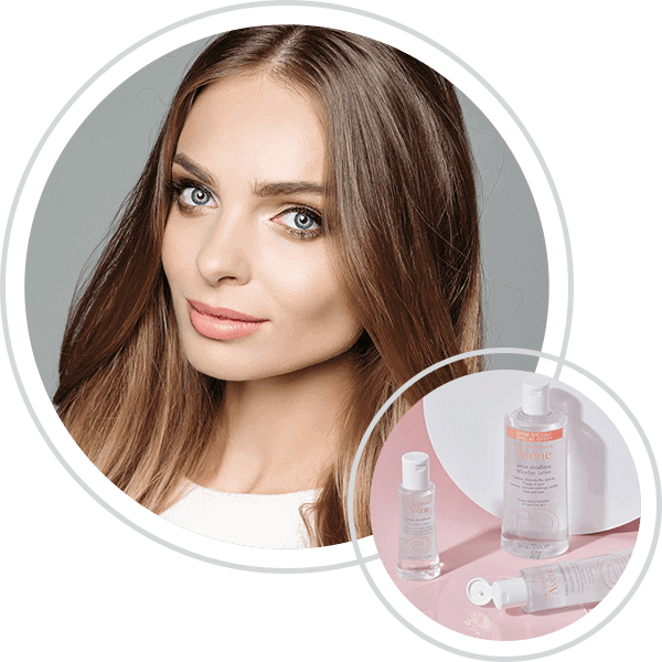 Smiling young woman with skincare products